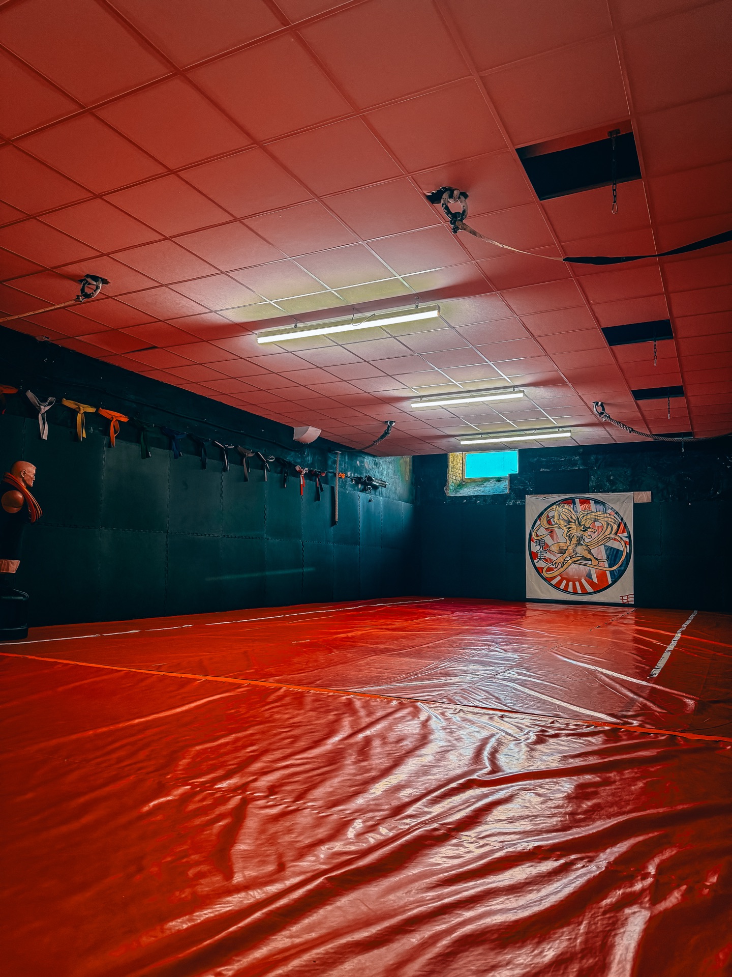 Genjitsu Martial Arts dojo — red mats and training area, Darwen